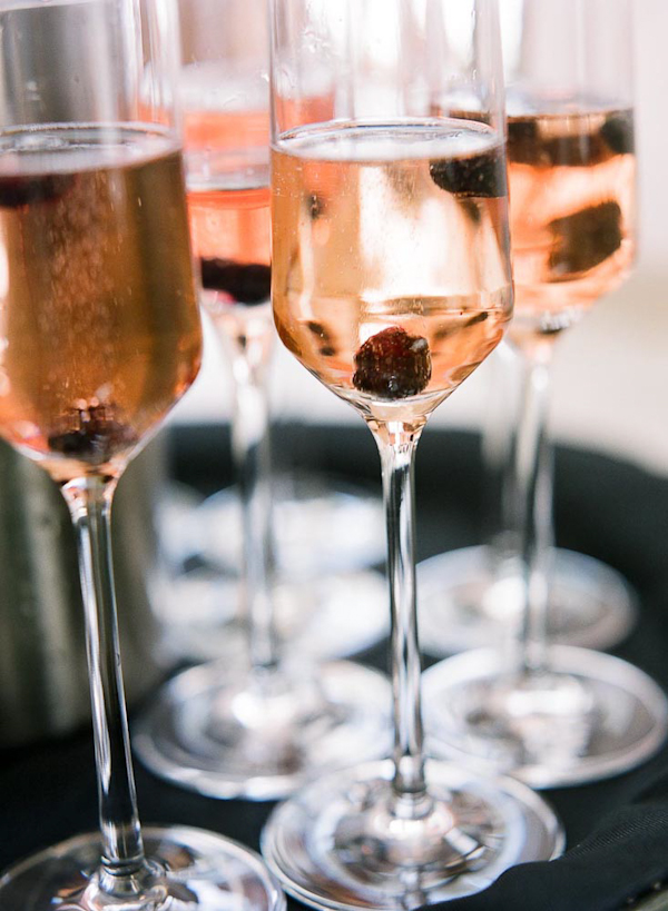 Pretty pink champagne glasses - wedding photo by top Austin based wedding photographers Q Weddings